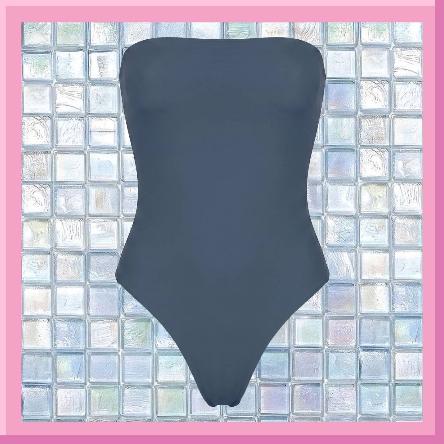 Navy strapless swimsuit against a glass block wall background